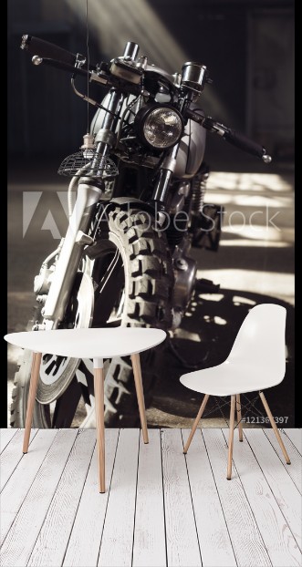 Picture of Motorcycle standing in dark building in rays of sunlight